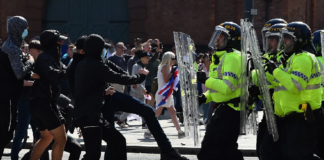 Migrant rights alert: Anti-migrant rioters in Great Britain assault Filipino nurses Layout of statement with picture of far-right rioters engaging with British police