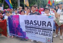 Filipino migrant workers and their families marching on 2025 Labor Day